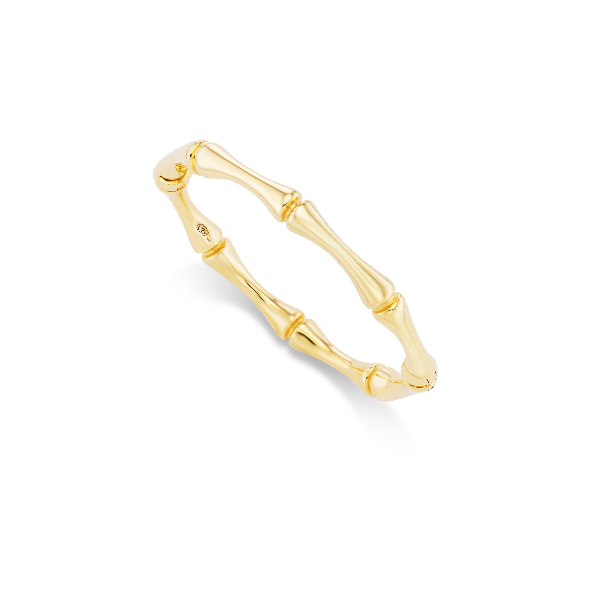 Gold bracelet with a bamboo design on a white background