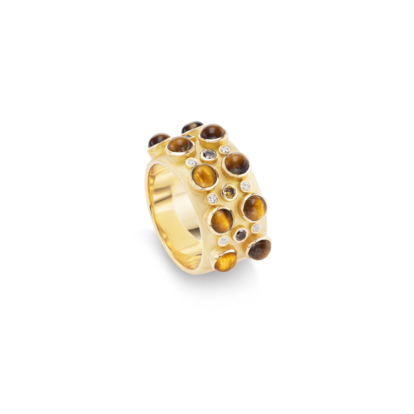A ring with multiple cabochon stones set in gold, featuring tiger's eye and blue sapphire accents.