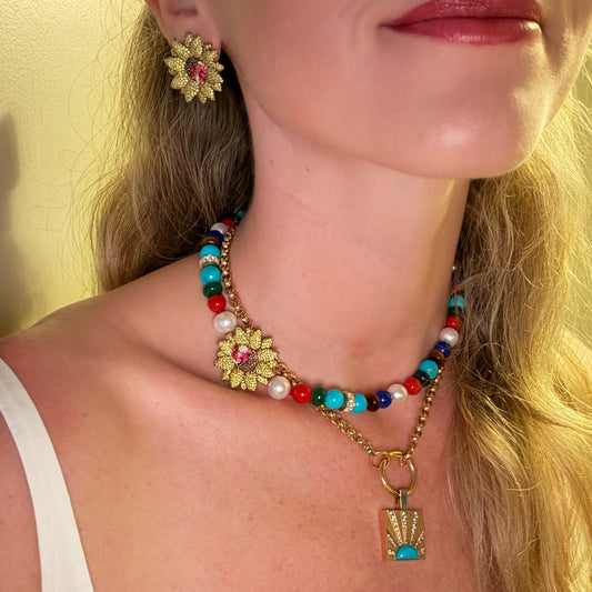 Woman wearing sunflower jewelry.