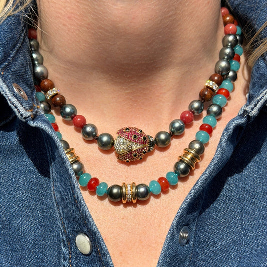 Woman wearing beaded necklaces.