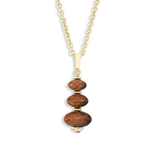 Necklace with wooden beads and gold accents on a white background