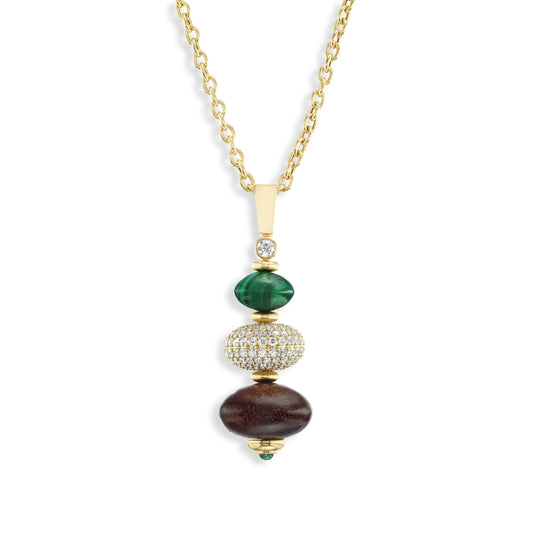 Necklace with gold chain, green Malachite, carved wood, and diamond beads on a white background