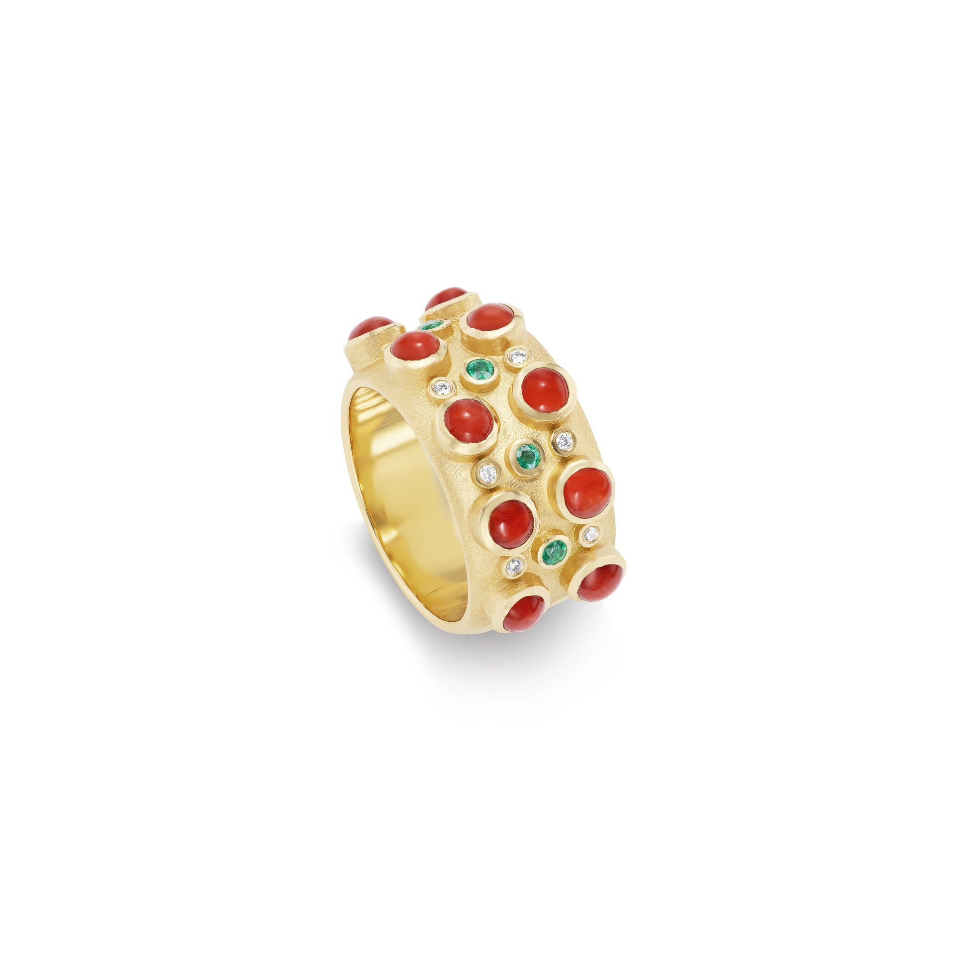 Gold ring with red and green gemstones on a white background