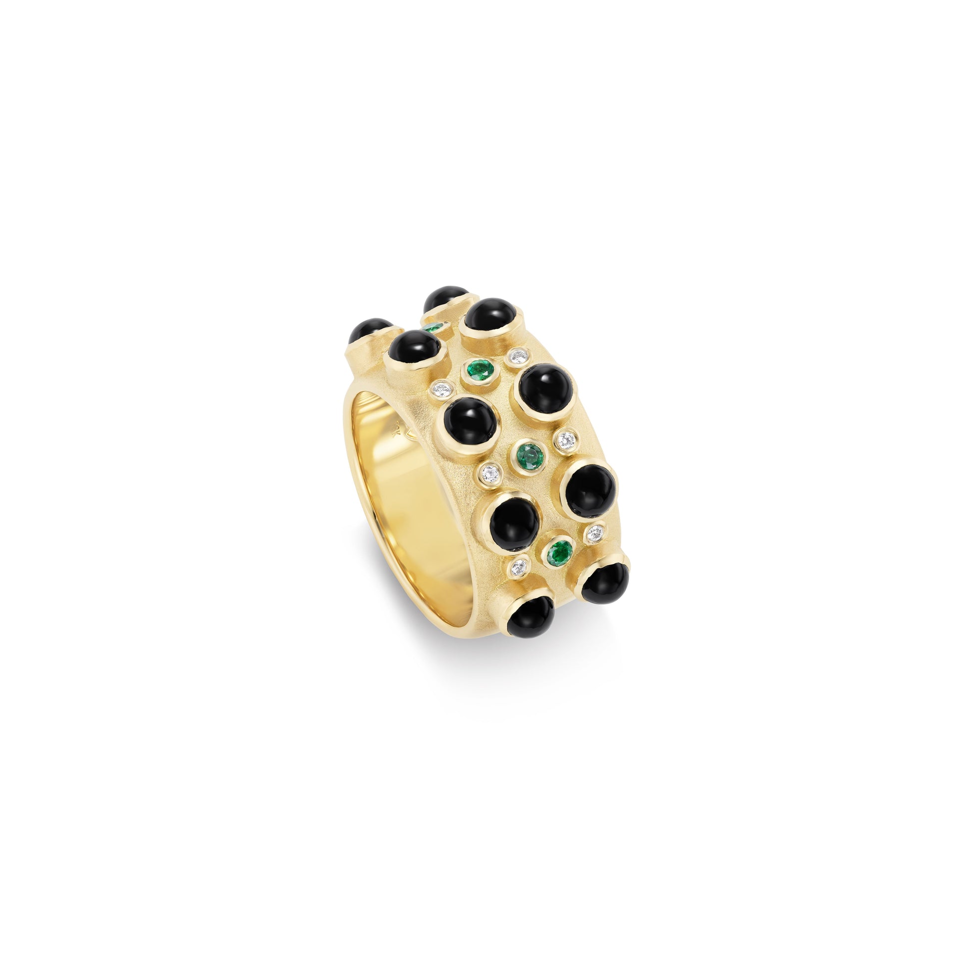 Gold ring with black and green gemstones on a white background