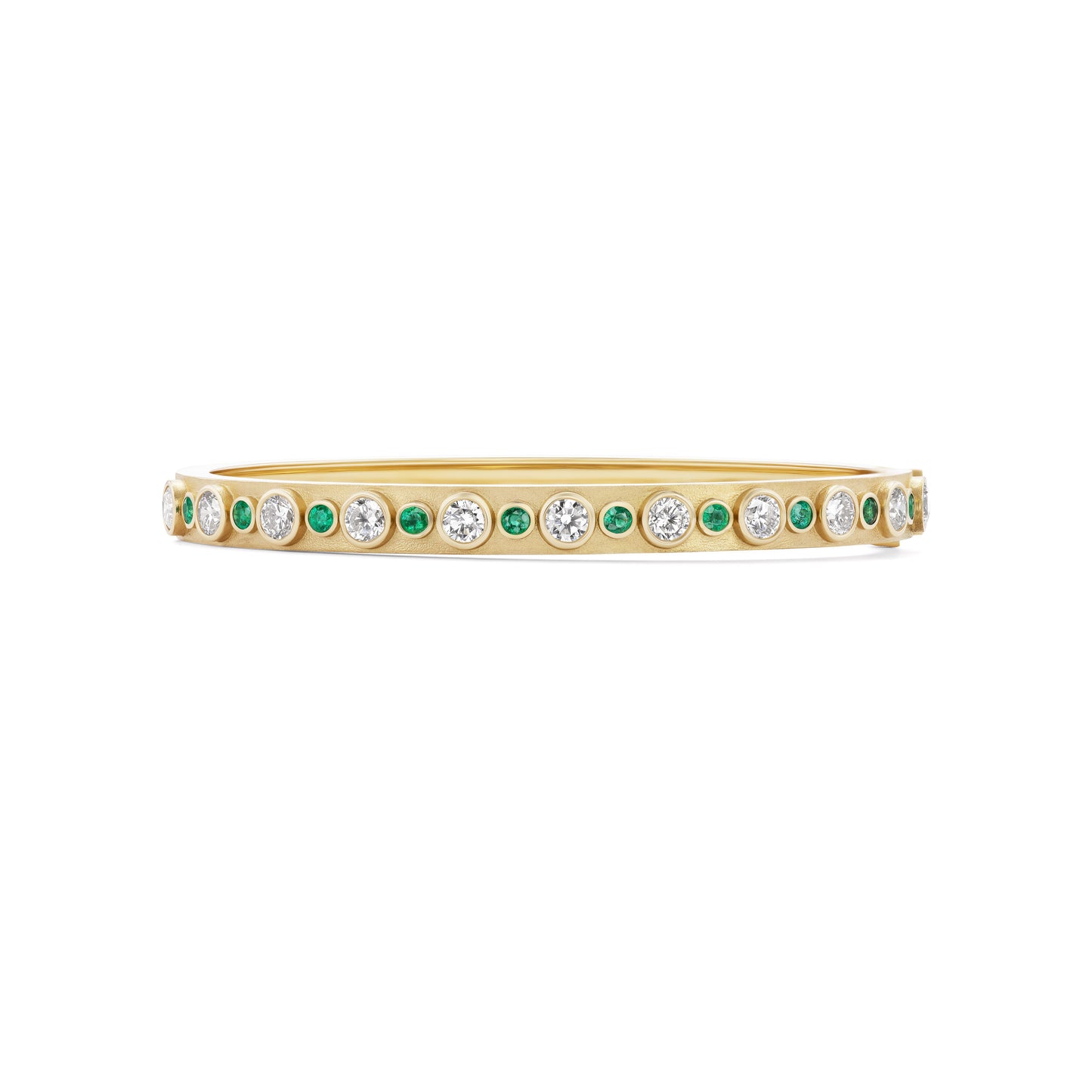 Gold bracelet with green and clear gemstones on a white background
