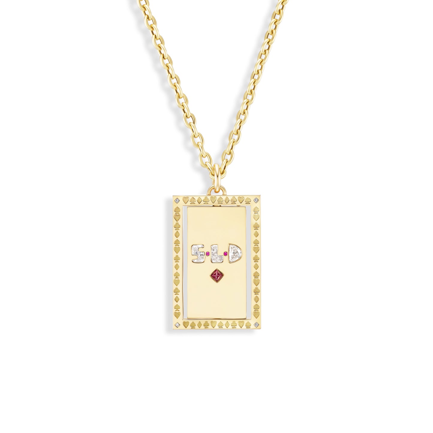 Gold necklace with a rectangular pendant featuring symbols and a red gemstone on a white background