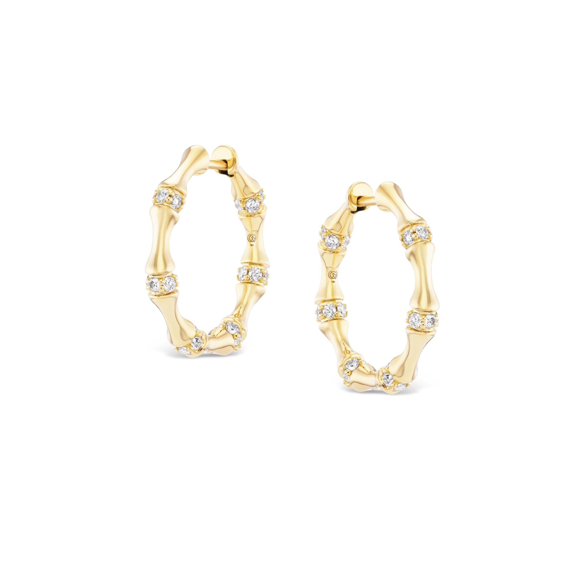 Gold hoop earrings with diamond accents on a white background