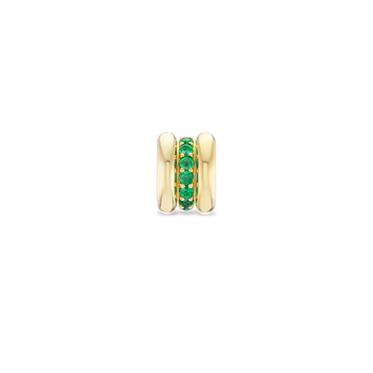 Gold charm with green gemstones on a white background