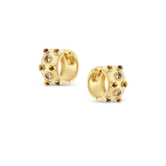 Gold hoop earrings with embedded stones on a white background