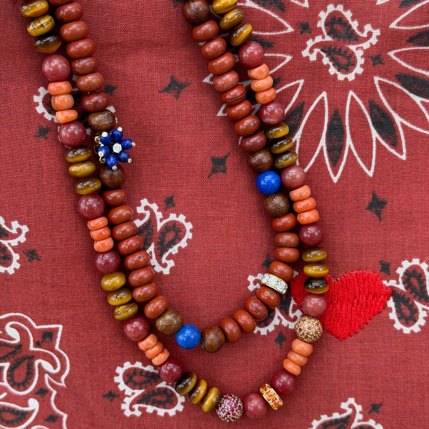 Beads on paisley background.