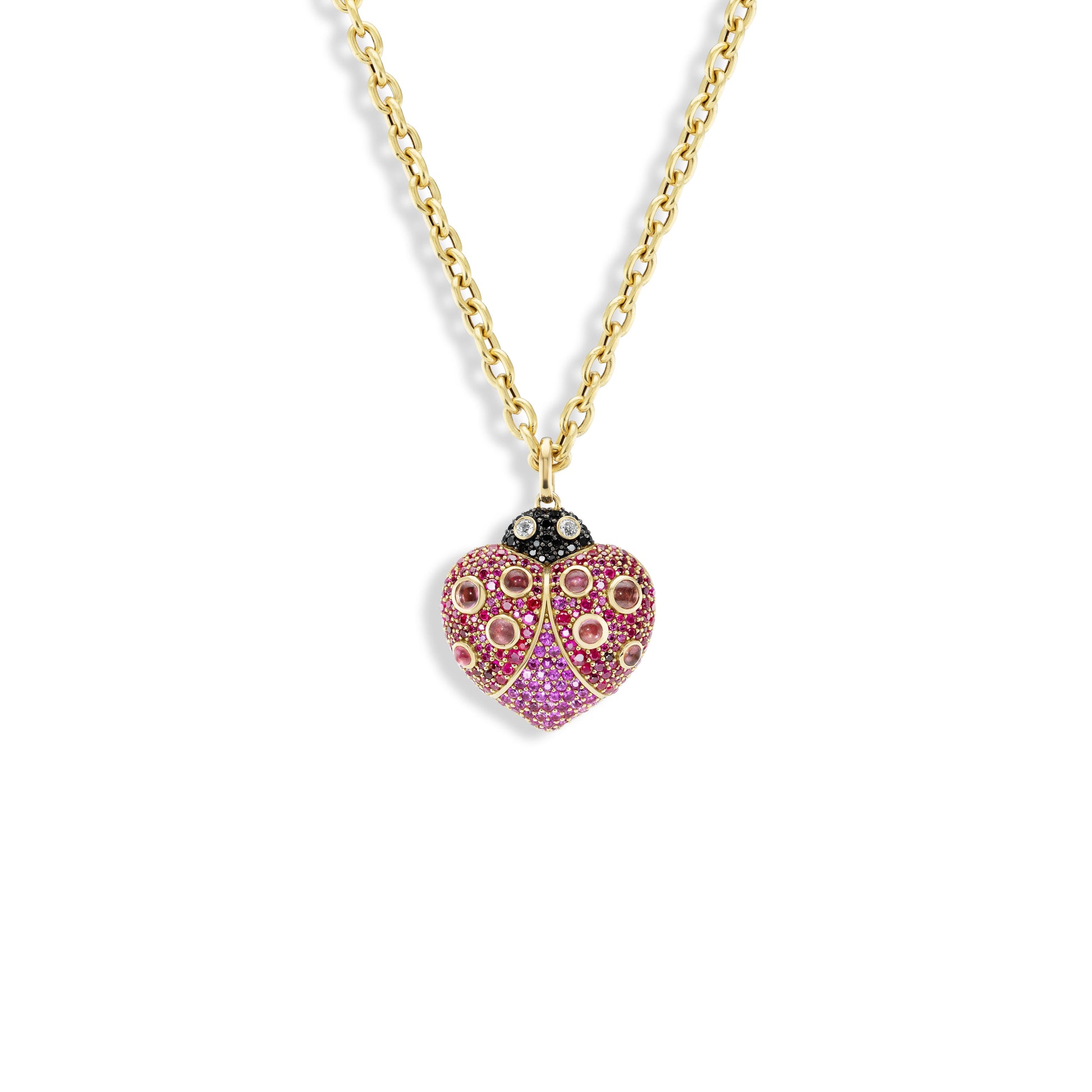 Heart-shaped pendant with pink stones on a gold chain against a white background