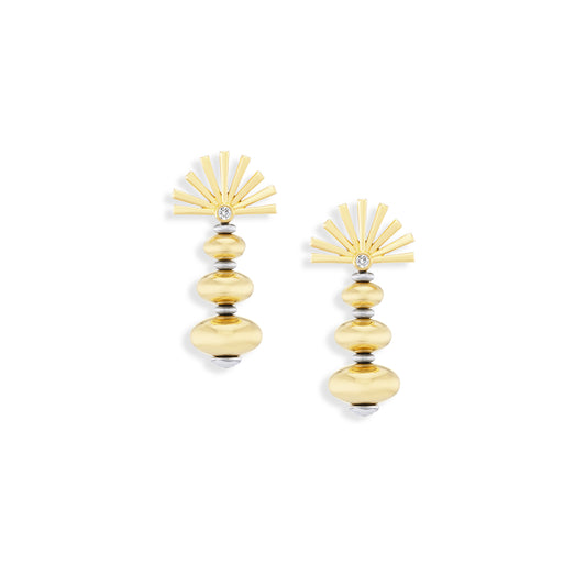 Gold earrings with sunburst design on a white background