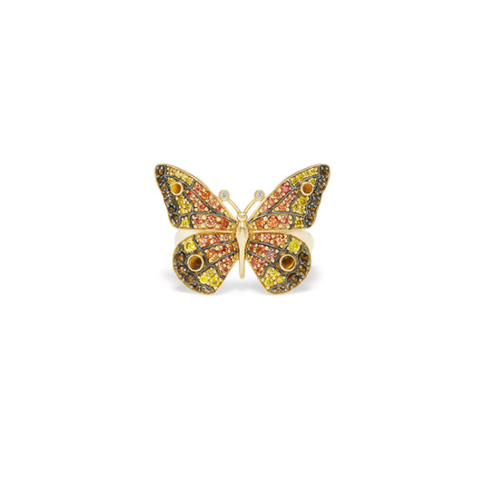 Butterfly-shaped jewelry piece with colorful stones on a white background
