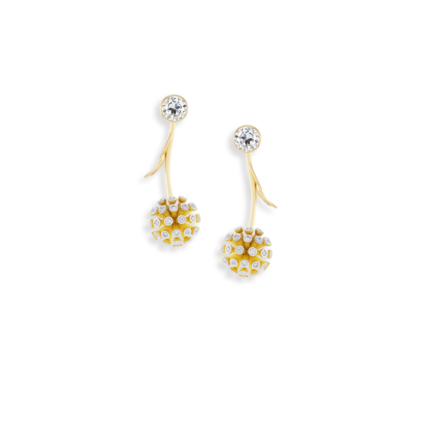 Pair of gold earrings with clear gemstones on a white background