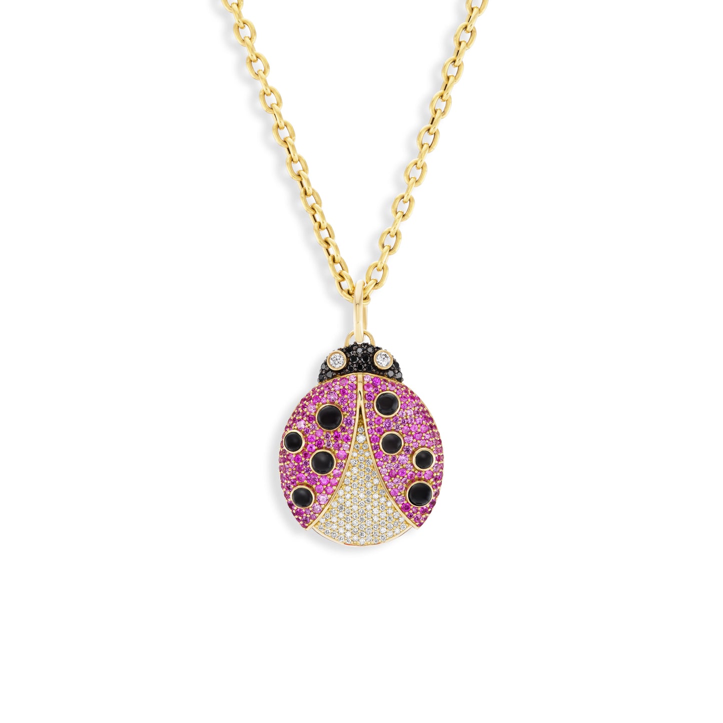 Gold necklace with a ladybug pendant featuring pink and black gemstones on a white background