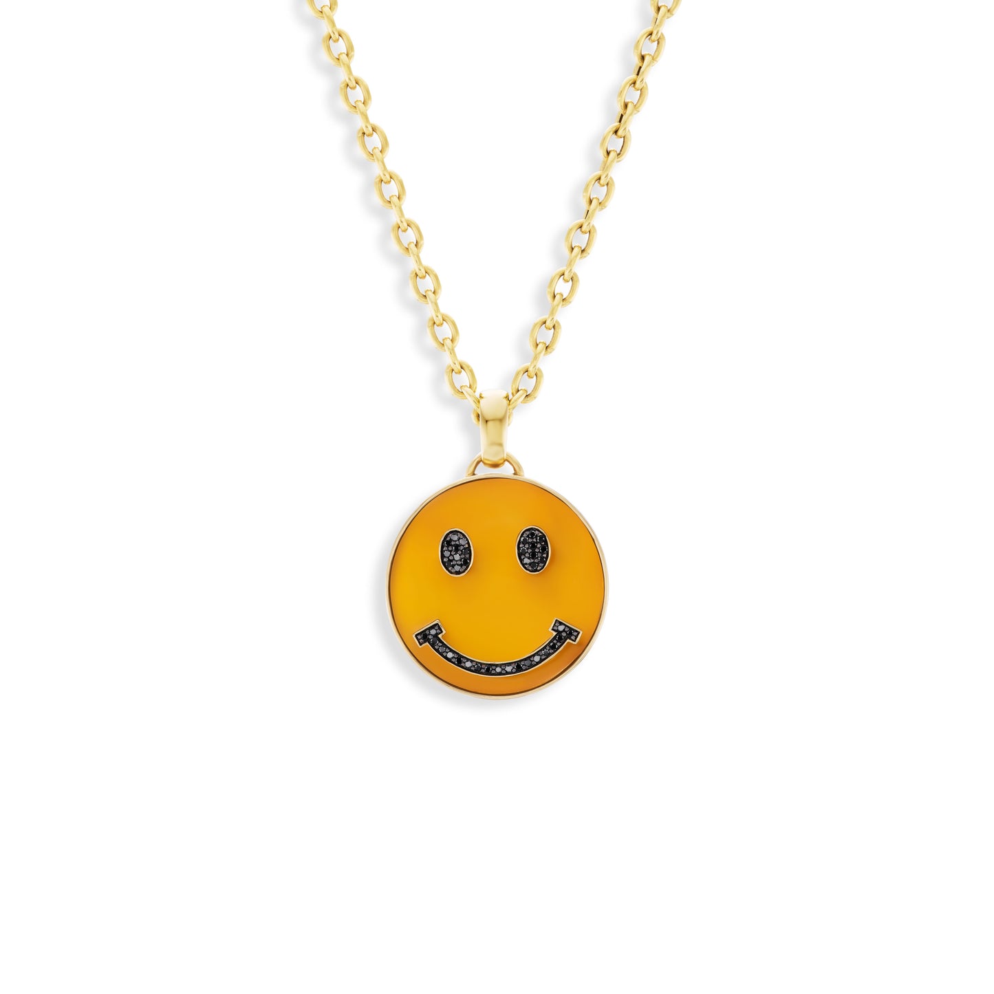 Gold necklace with a smiley face pendant on a white background