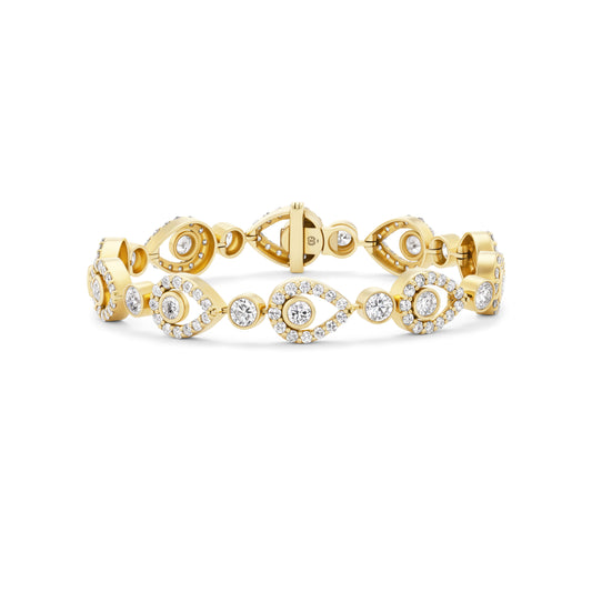 Gold bracelet with diamond accents on a white background