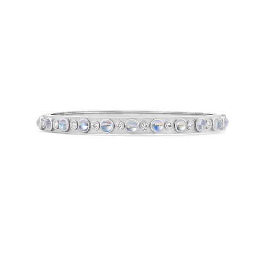 Silver bracelet with embedded stones on a white background