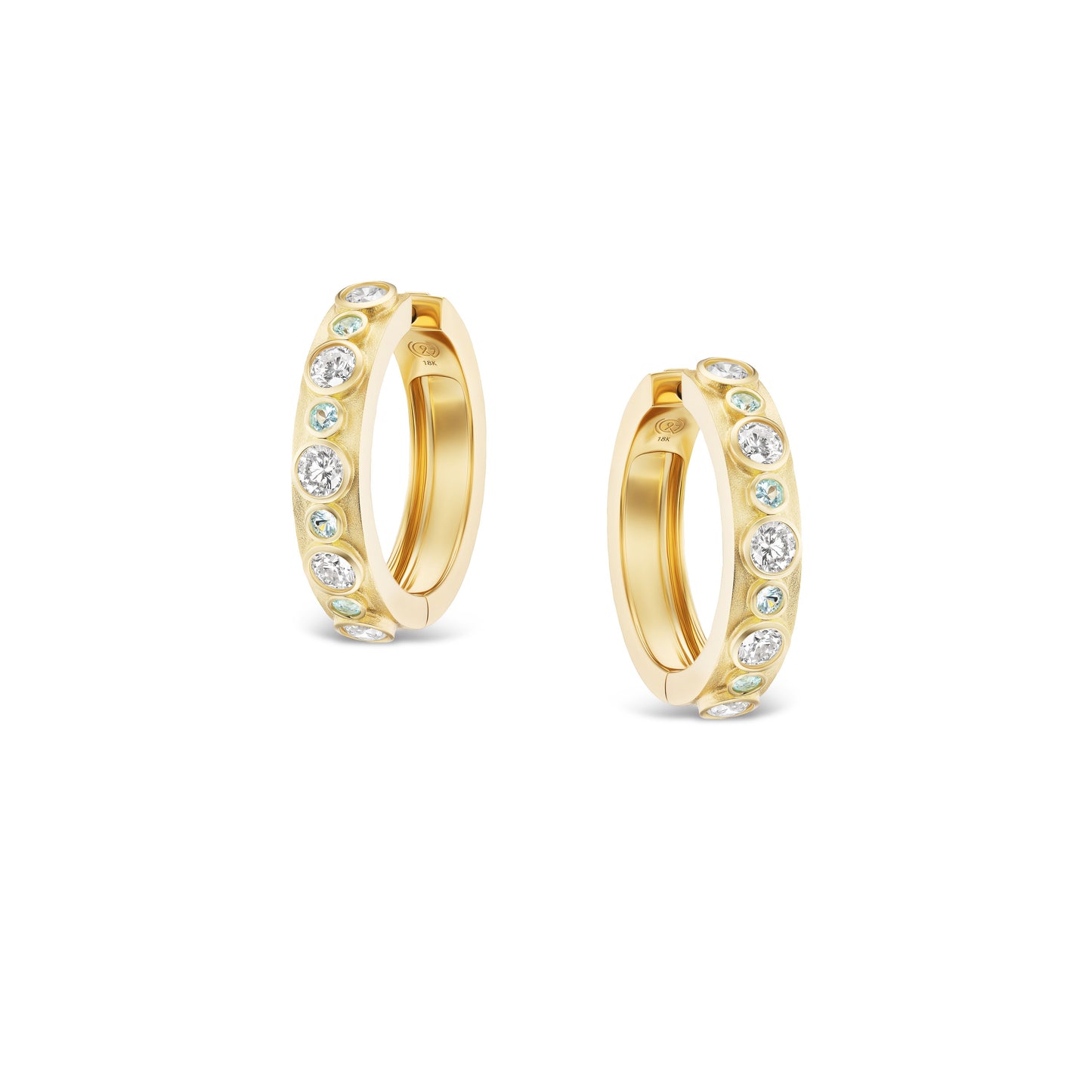 Gold hoop earrings with embedded stones on a white background
