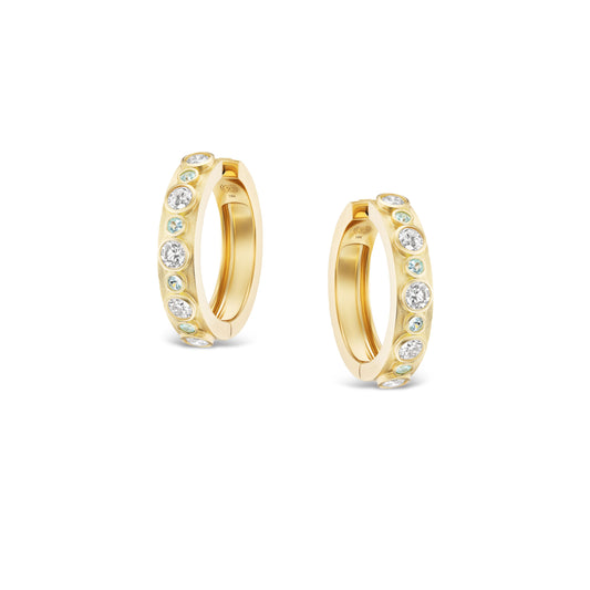 Gold hoop earrings with embedded stones on a white background