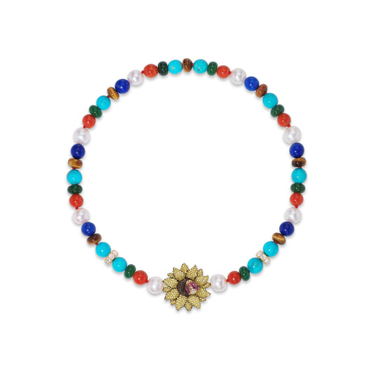 Multicolored beaded necklace with a decorative sunflower clasp on a white background
