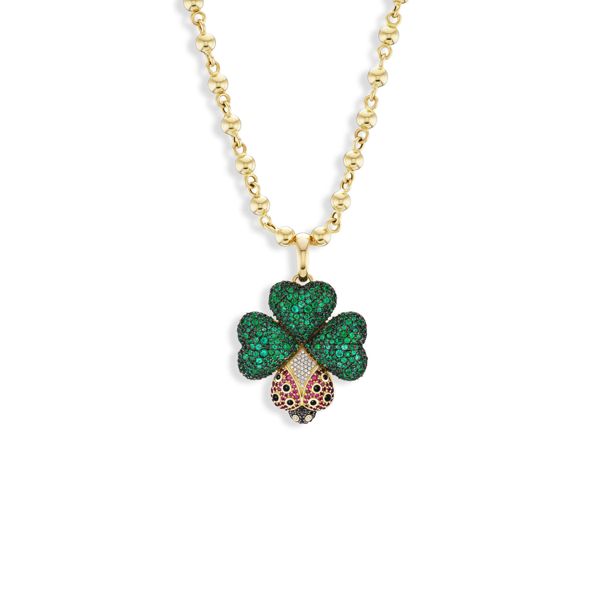 A gold chain necklace featuring a clover-shaped pendant with emerald green pavé-set leaves and a gold-and-pink pavé-set center, shown on a plain white background.