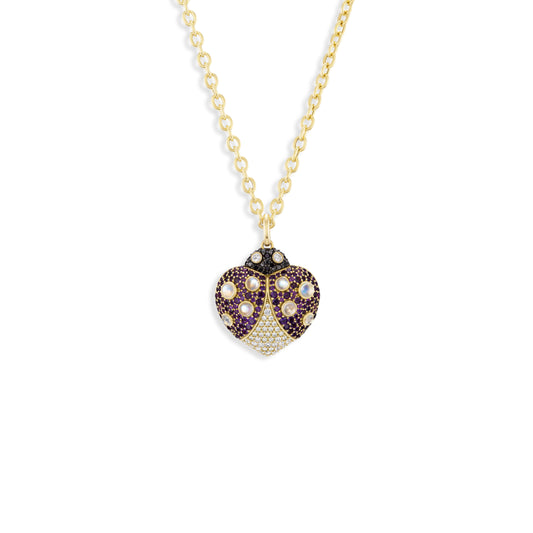 Heart-shaped gemstone pendant necklace on a white background