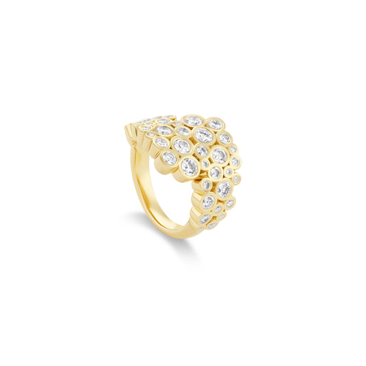 Gold ring with diamond accents on a white background