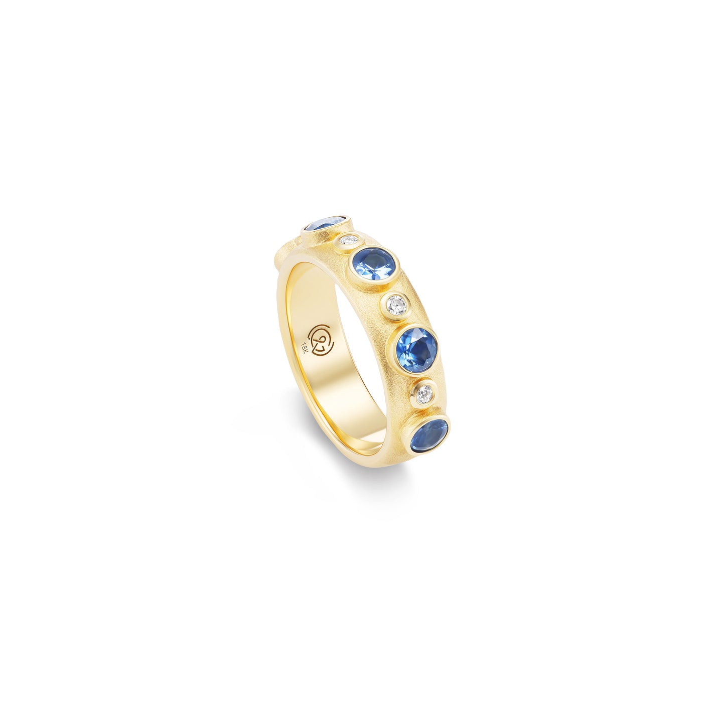 Gold ring with blue gemstones on a white background